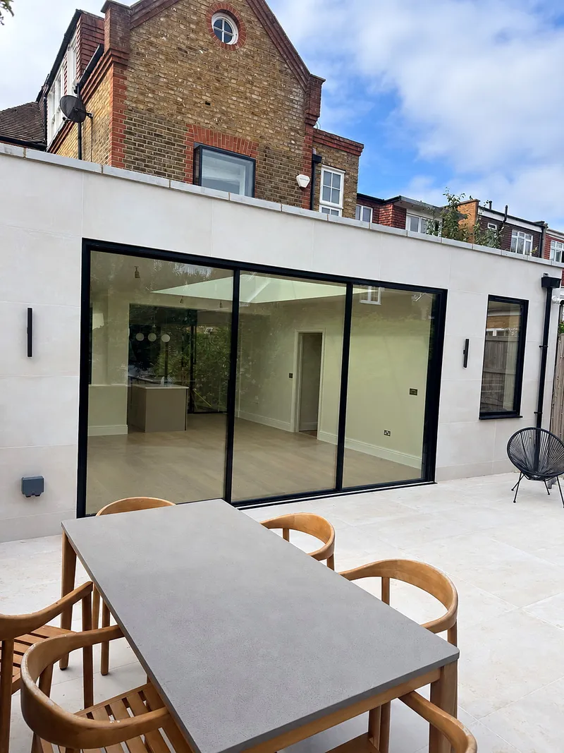 Rear extension with skylight and modern kitchen design in Wandsworth, South West London by Bluebird Spaces