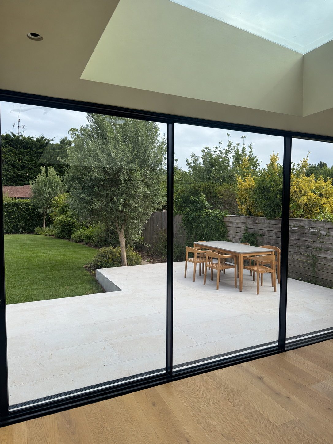 Completed Wandsworth rear extension with structural glazing and landscaped garden by Bluebird Spaces